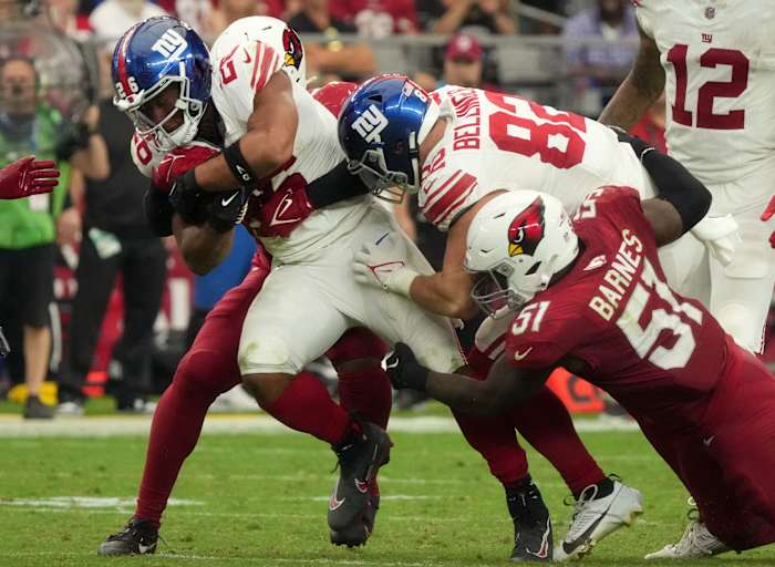 Sep 17, 2023; Glendale, AZ, USA; New York Giants running back Arizona Cardinals (26) runs the ball against the Arizona Cardinals at State Farm Stadium.